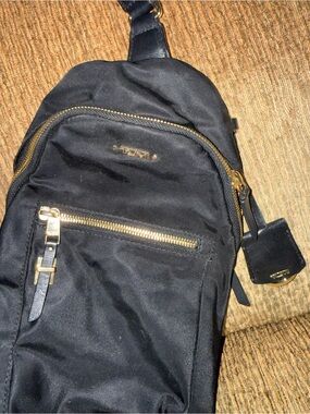 Tumi Black Sling Belt Bag with Gold Hardware